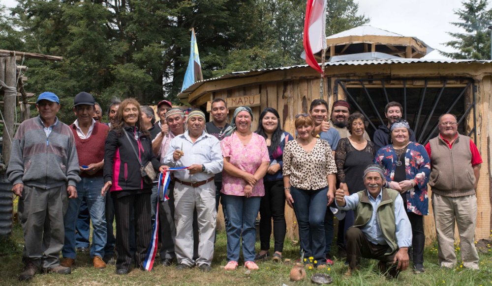 Members of the Mapuche Peñi Mapu community inaugurate the traditional building, which they constructed with materials provided by Puelche Sur Wind Farm