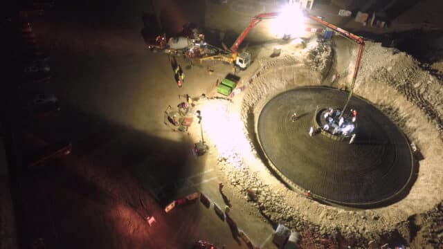 Aerial view of turbine foundation concrete pour at night