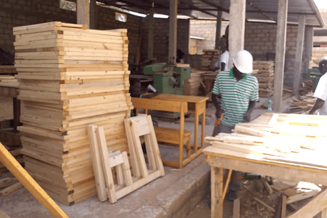 Carpenter at work on turbine crate