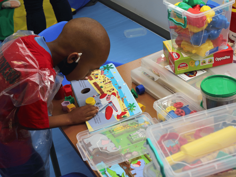 pre-primary school pupils playing in new classroom