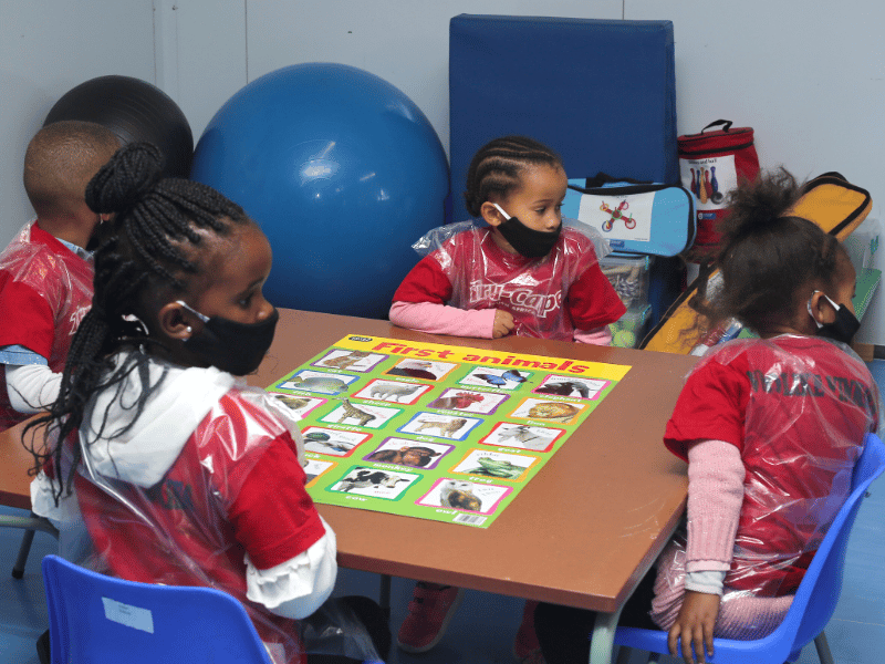 pre-primary school pupils playing in new classroom