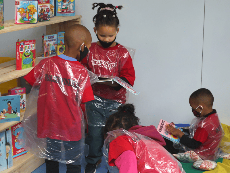 pre-primary school pupils playing in new classroom