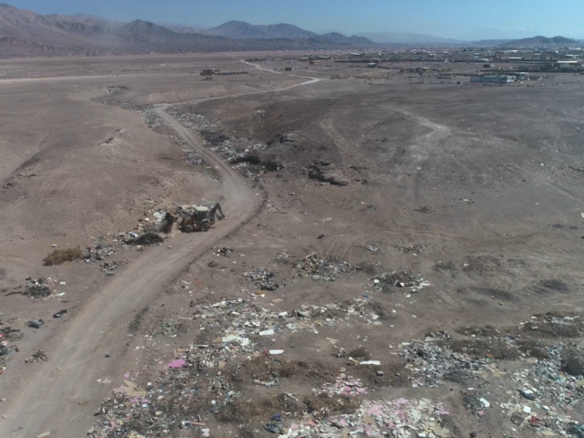 Excavators and bulldozers cleaning up desert