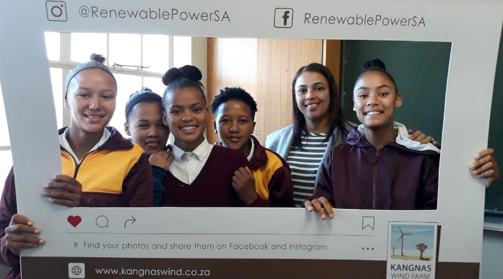 Group of school children pose with instagram frame