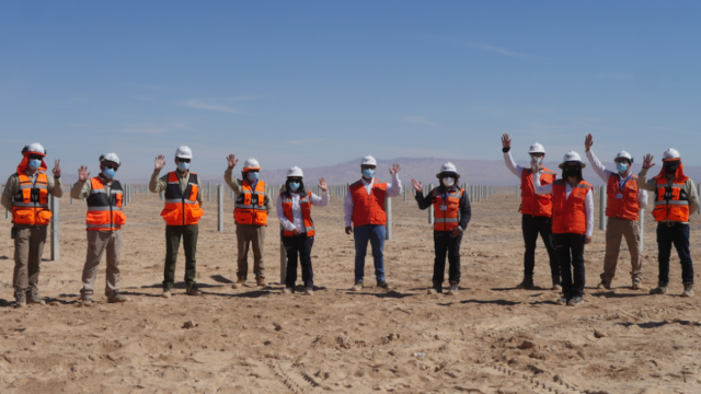 The Regional Energy Minister, centre, and his Mainstream guides inspected progress at the 100 MW Pampa Tigre Solar PV Farm