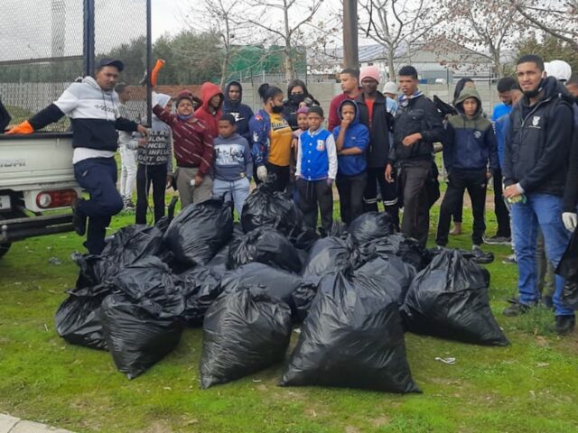 Young volunteers with rubbish collected