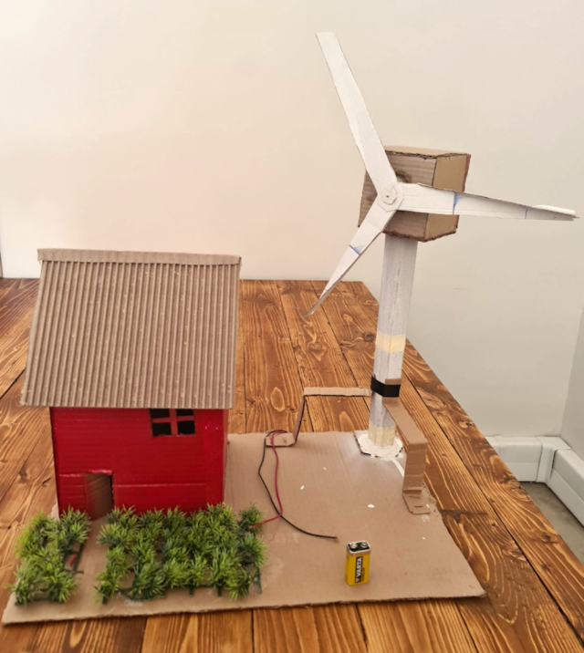 Physics students had to build cardboard models showing how a wind turbine powers a home