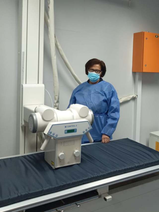 Assistant Nurse Christine Rowan with new X-ray unit