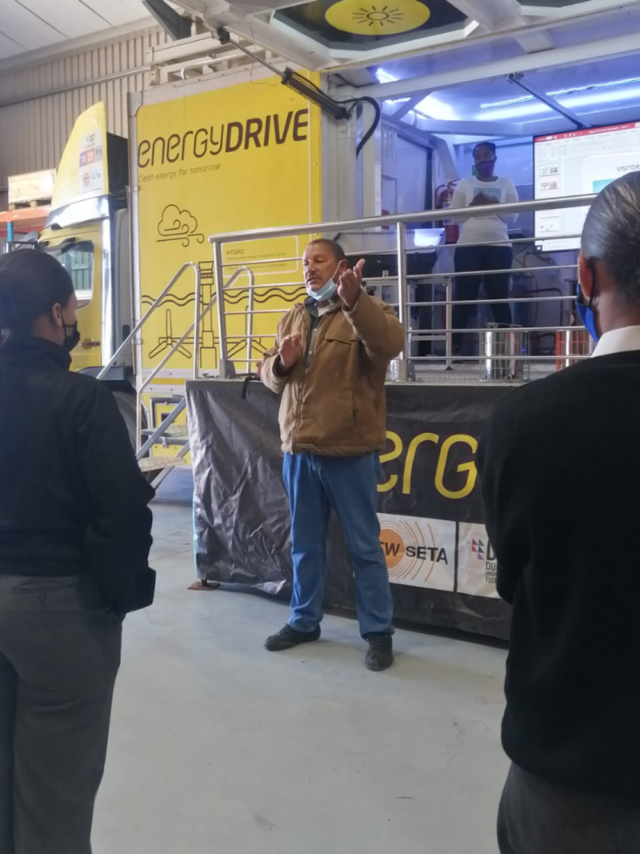 Man speaking during Energy Drive initiative