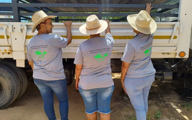 Women standing at delivery truck in South Africa