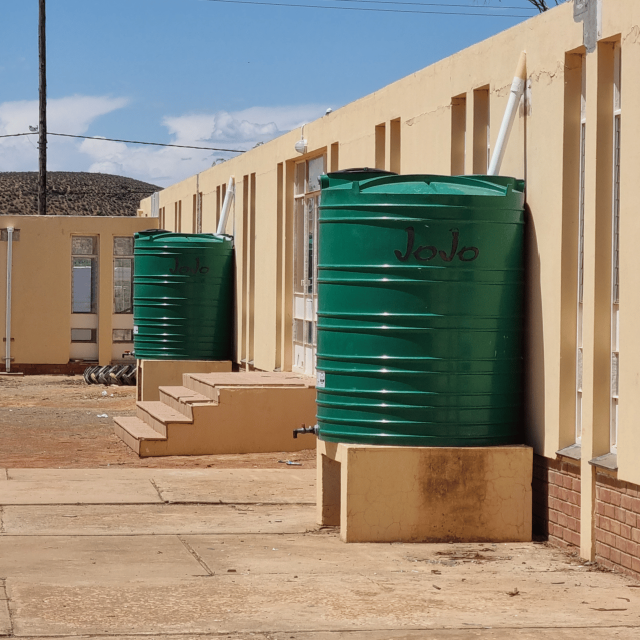 local worker installs new toilets and asbestos-free water containers