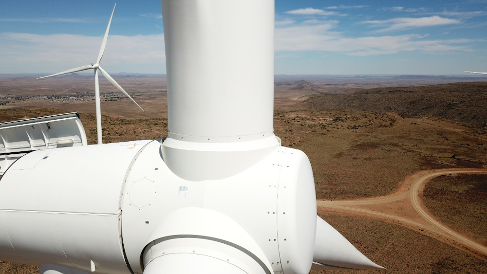 Close up of wind turbine nacelle against South African landscape