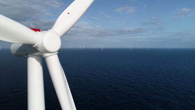 Close up of wind turbine nacelle against North Sea scene