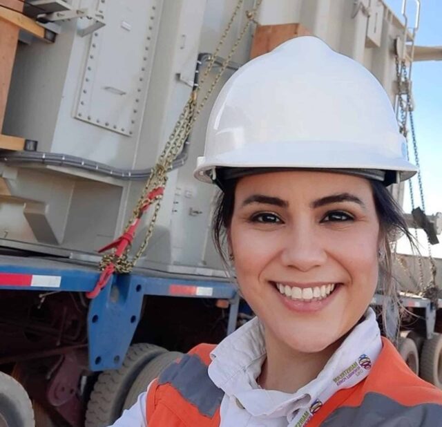 woman with hi vis jacket and hard hat smiling in a selfie photo - vision mission values of Mainstream Renewable Power