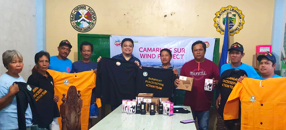 Members of the tanod peacekeeping action team of Pag-Oring Nuevo Phillippines recieving new equipment donation