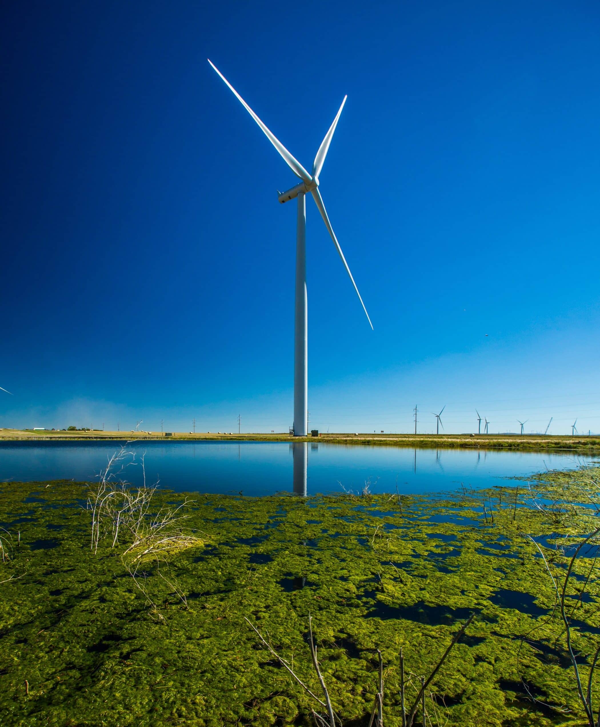 onshore wind turbine in front of a lake - about us - mainstream renewable power