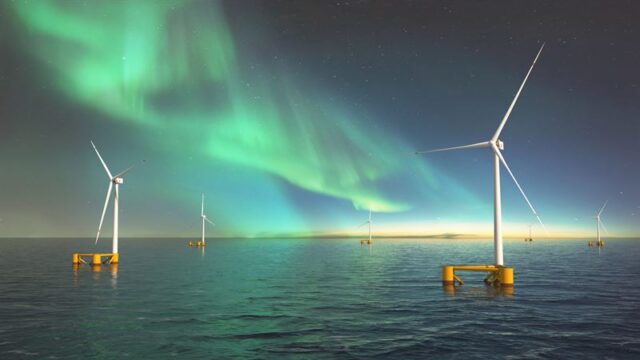 CGI of the northern lights in night sky above six floating offshore wind turbines