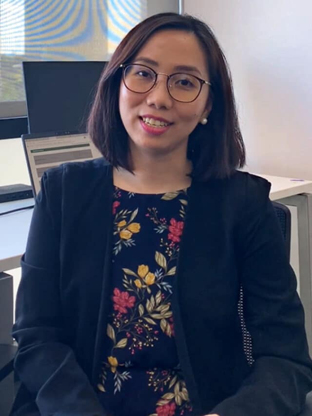 Smiling Mainstream Renewable power woman in Manila office