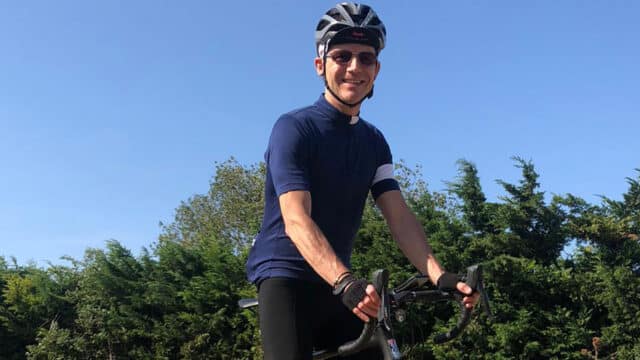 Mainstream's Randal Barker in cycling gear on a bike