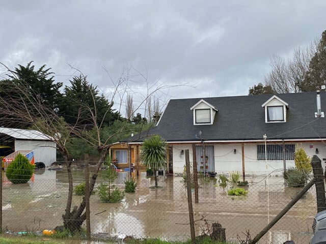 Flood water surrounds house in village close to Mainstream wind farm